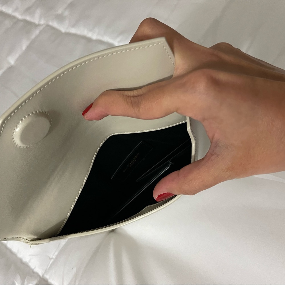 •Magnetic flap closure
•Gold-tone logo hardware at front
•Fabric lining - Picture 5 of 6